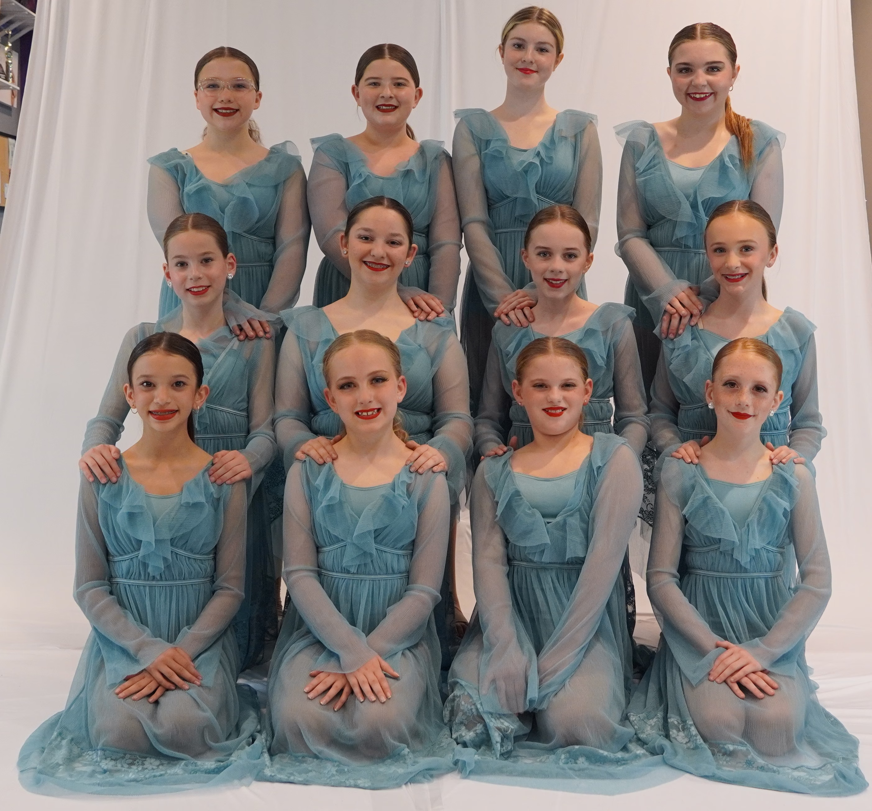 Dancers stretching and practicing in the Dynamic Dance Center studio